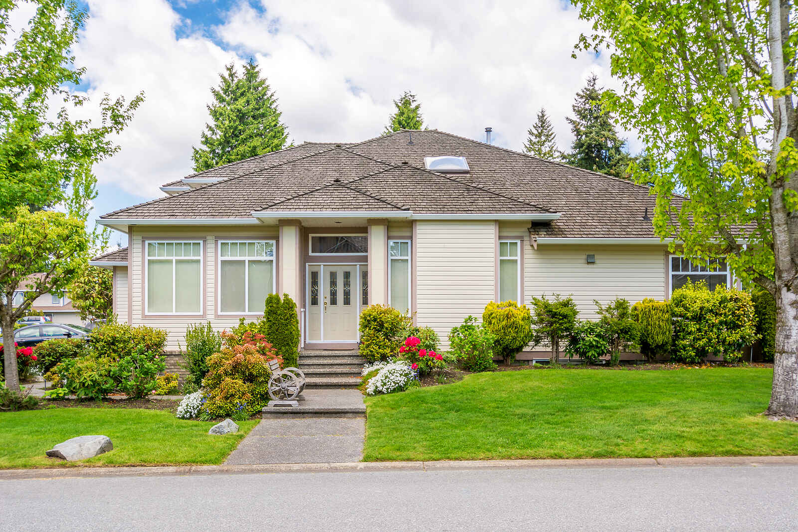 Luxury house with beautiful landscaping. Home exterior.